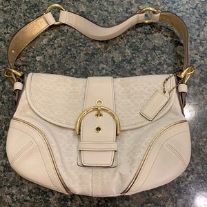 Coach white and gold bag.